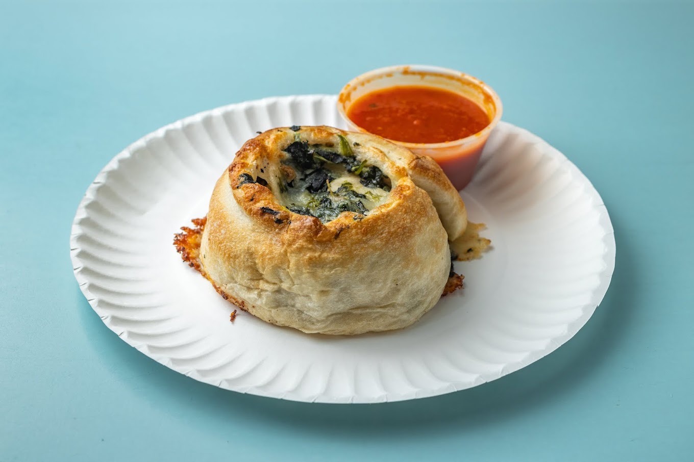 Pizza Supreme baked roll with marinara sauce
